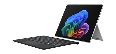 Microsoft Surface Pro 13" with the kickstand extended, a detachable black keyboard, and a colorful display on a white background.