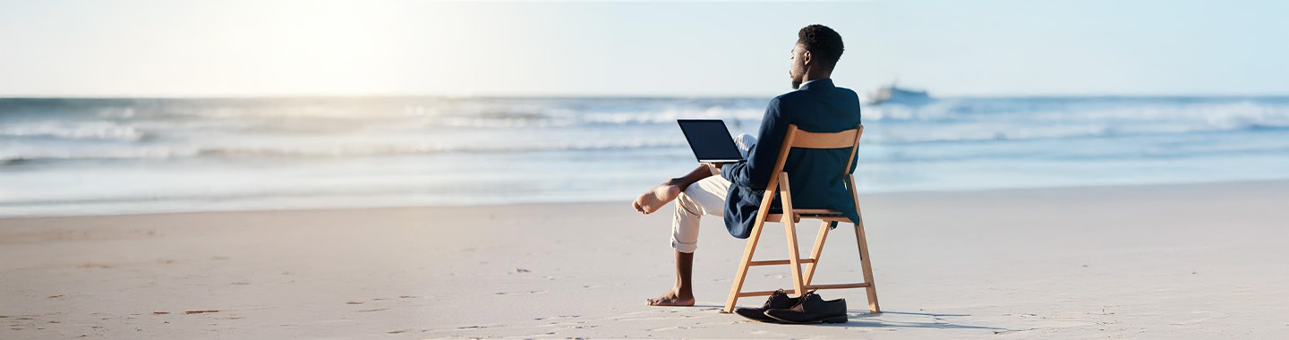 Men with Notebook at the Beach Mainbanner