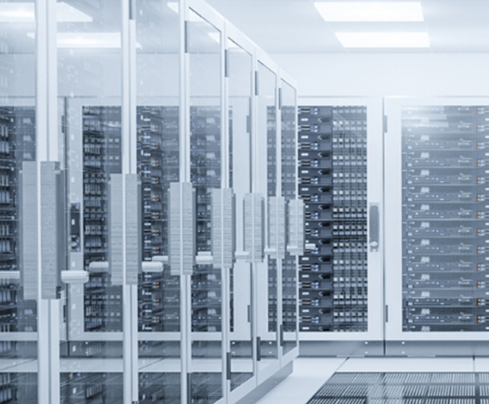 Server room with multiple rows of network cabinets for data processing and storage