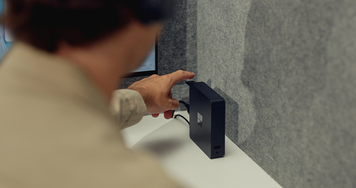 Microsoft Windows 365 Link | Man turning in the device.