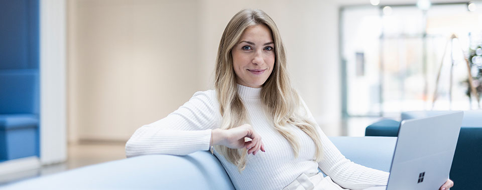 Woman sitting at a lounge in the office