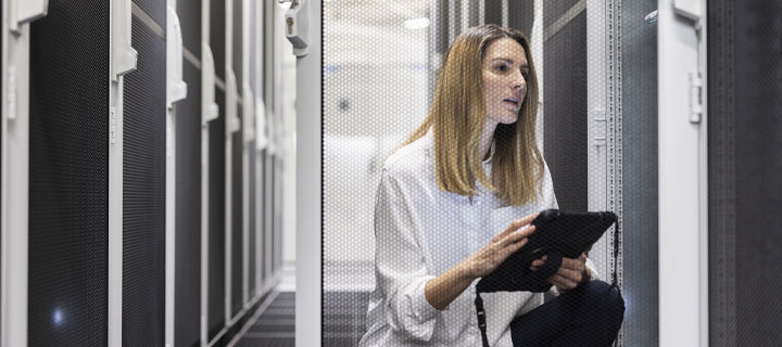 Woman with tablet checking data servers
