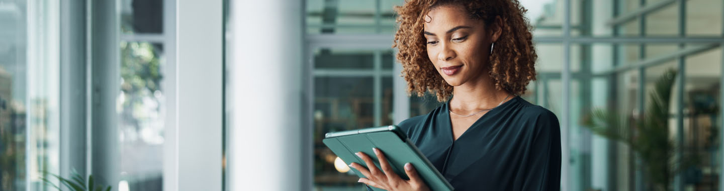 Woman standing with tablet