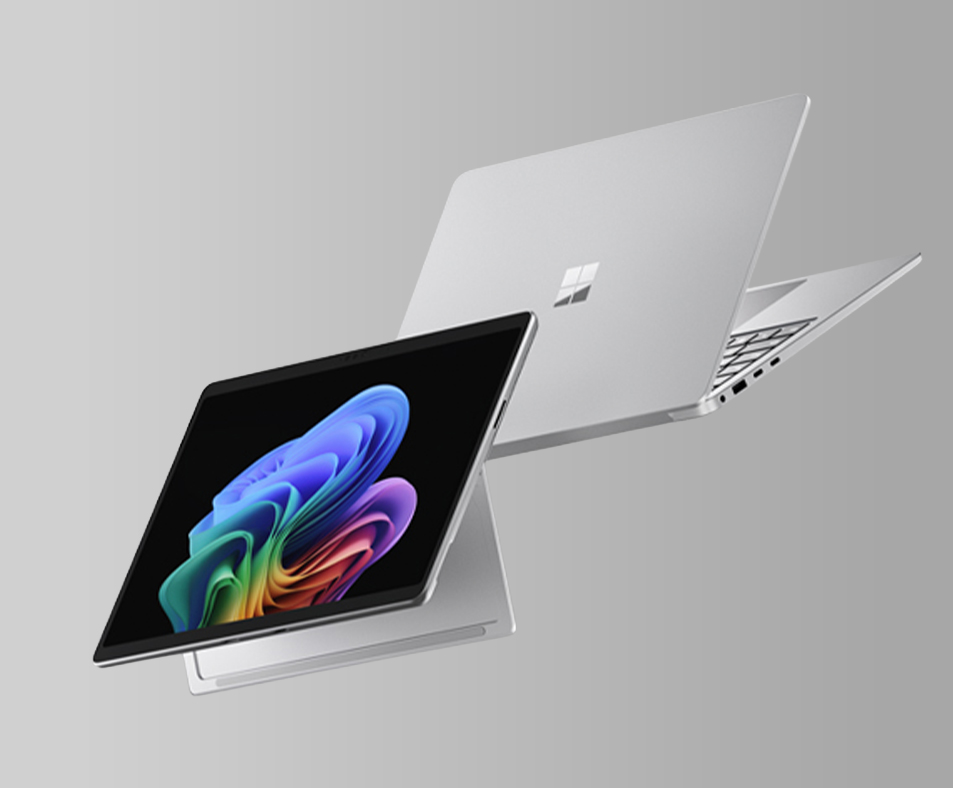 Microsoft Surface for business with Snapdragon. 2 silver devices flying.