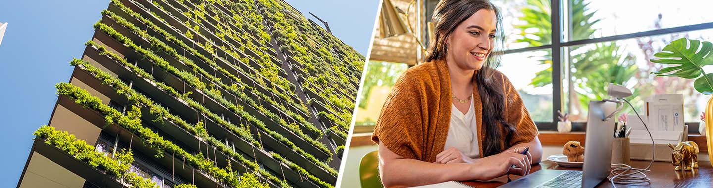 Green building & woman sitting in an office with an HP notebook surrounded by plants