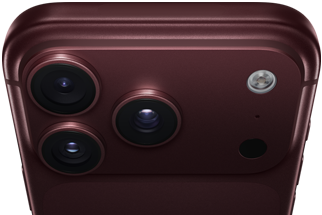 Close-up of the back of a smartphone featuring three camera lenses and a flash in a dark color