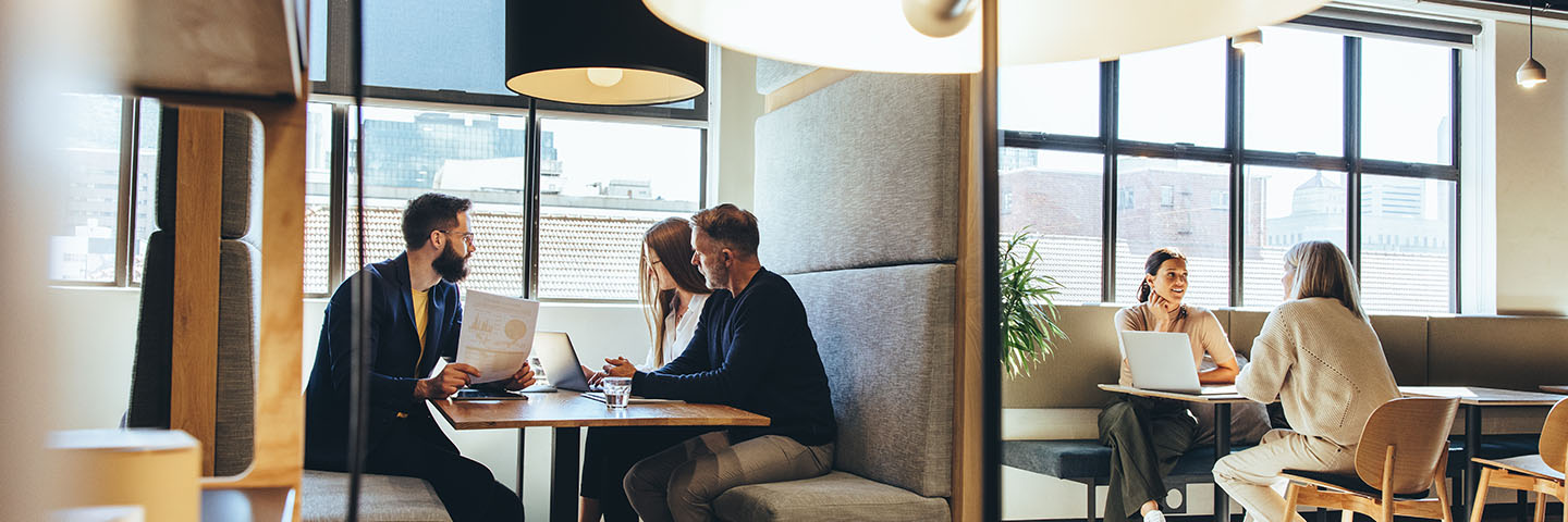 Colleagues sitting at tables