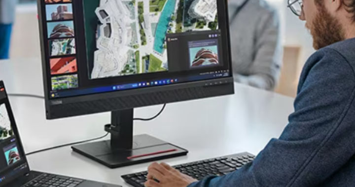 6Grid Banner - Man with Lenovo Monitor