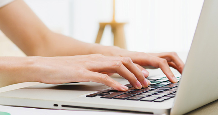 Bechtle UK Blog banner. Hands writing on notebook.