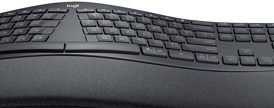 Ergonomic keyboard with split key layout and padded wrist rest for comfortable typing experience