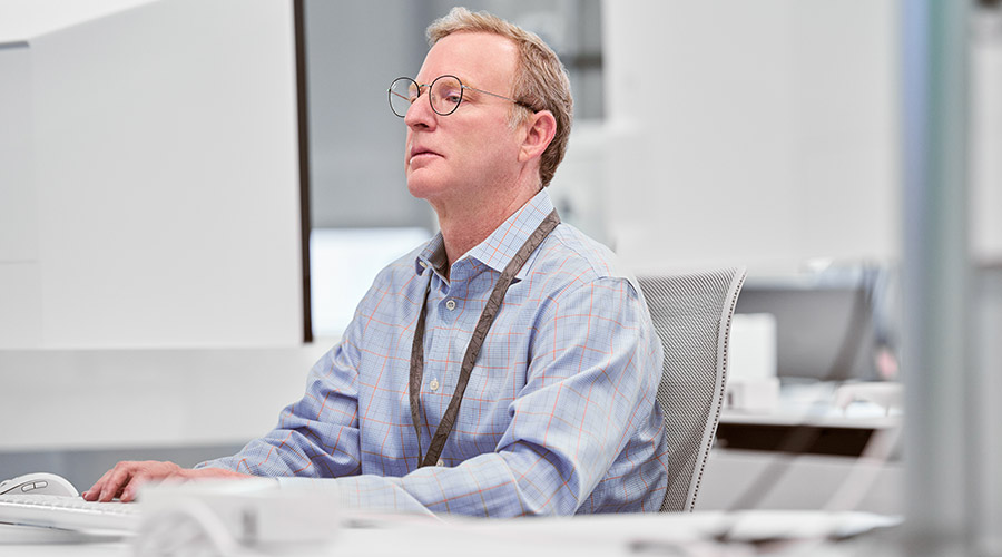 An administrator looks at a screen