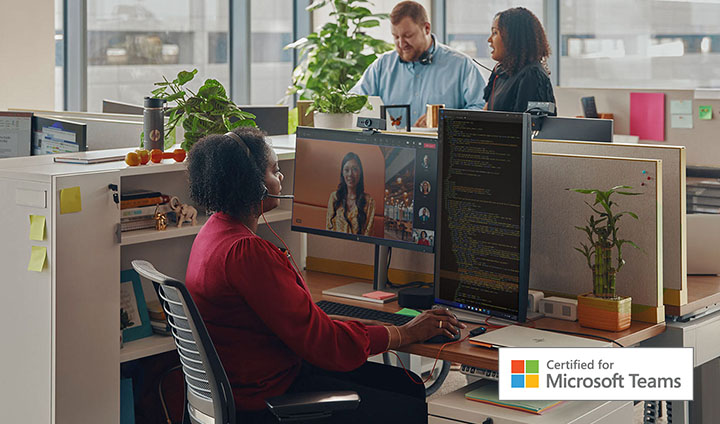Woman working in the office, using the Blackwire Headset