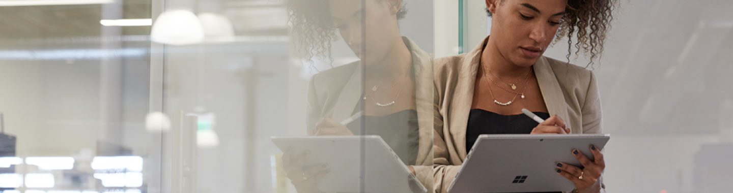 Woman working on a Microsoft device