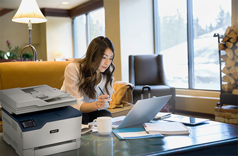 Xerox Printer Woman working on a desk