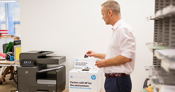 Employee using recycling bin
