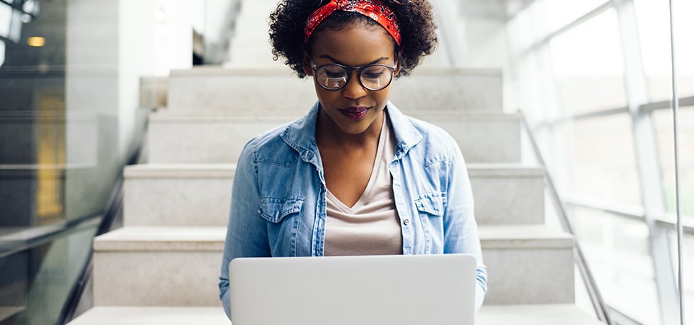 Woman working on Macbook