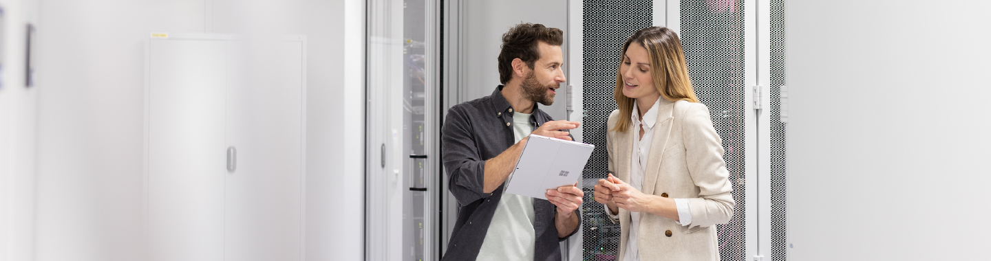 A man and a woman are talking in data center