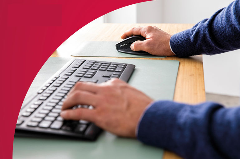 closeup hands working with CHERRY devices