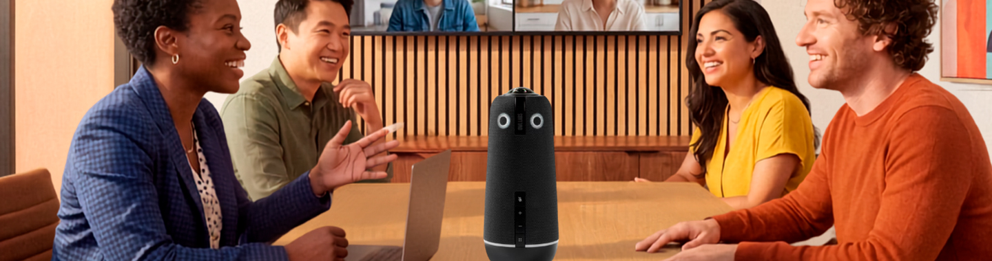 Four people in a meeting room conducting a video conference with a Owl Labs amera for virtual collaboration