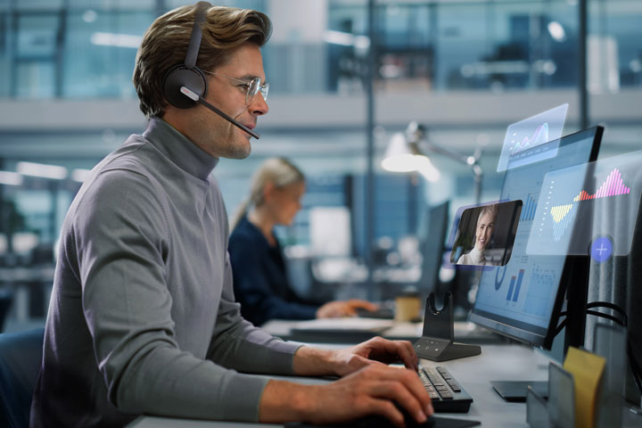 Man working with WH64 Headsets
