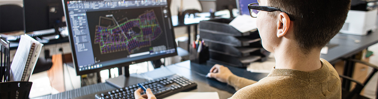 Man working on a 2D CAD software