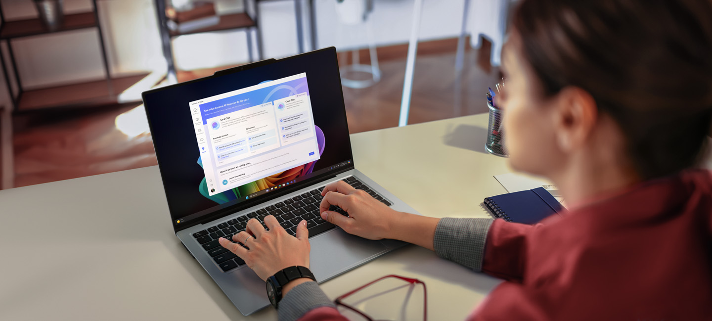 A woman is typing on her laptop