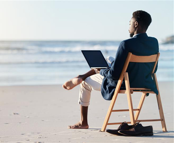 Man sitting on the beach with surface