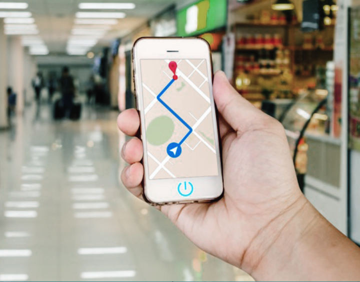 Hand holding a smartphone with navigator 