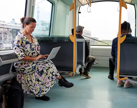 Woman with Notebook in the Bus