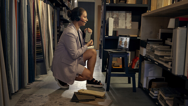 productivity: woman in a tams meetings sitting in front of her laptop