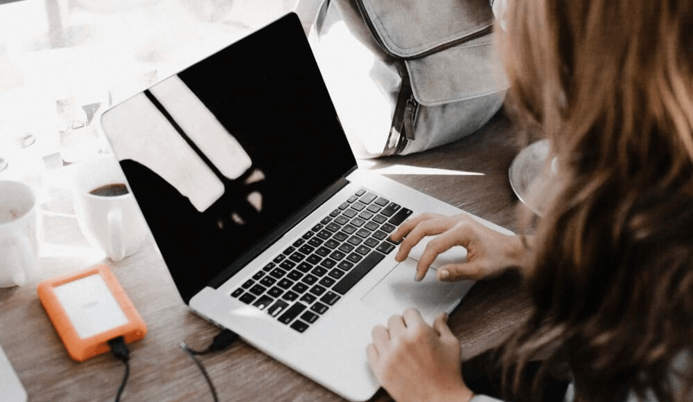 Woman making a backup of her computer.