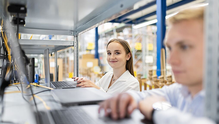 Woman and Man working on a notebook