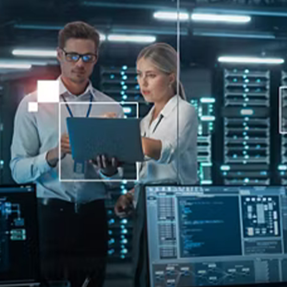 People working in the Lab in front of PCs.