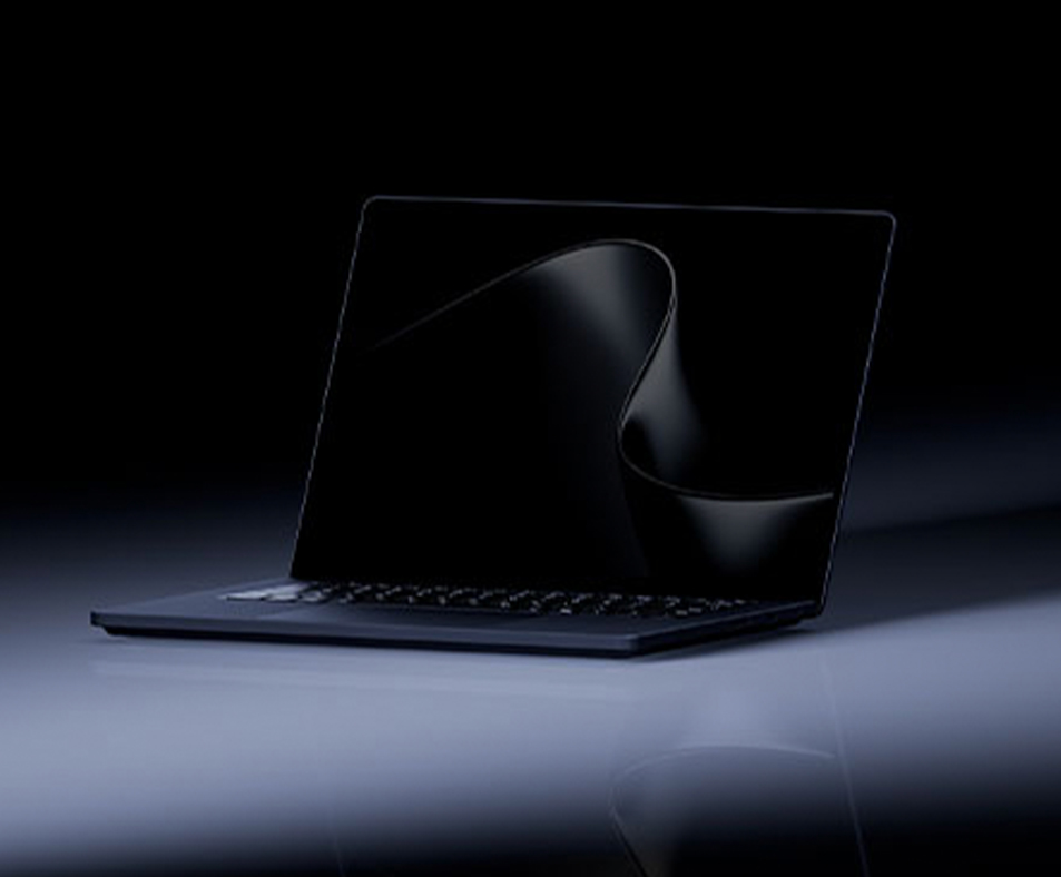 The new Microsoft Surface Laptop Ultra in black sourrunded by darkness & light.