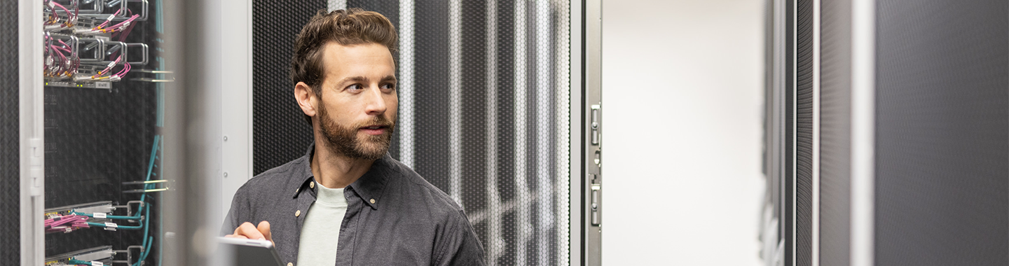 A man working in server room