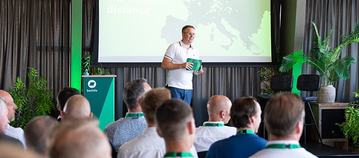 Presentation in modern conference room focusing on speaker and audience in a business setting