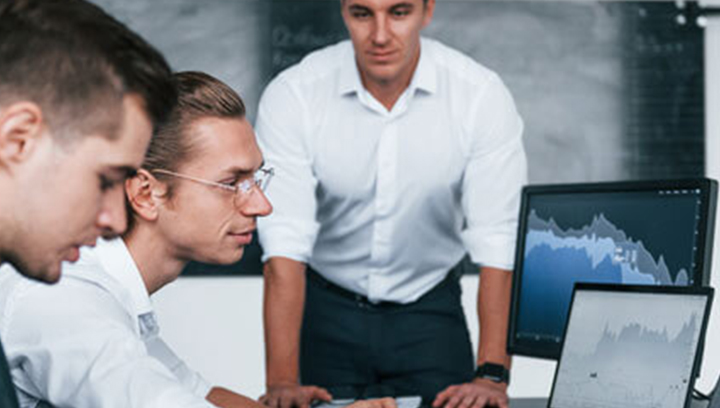 three people in an operations center