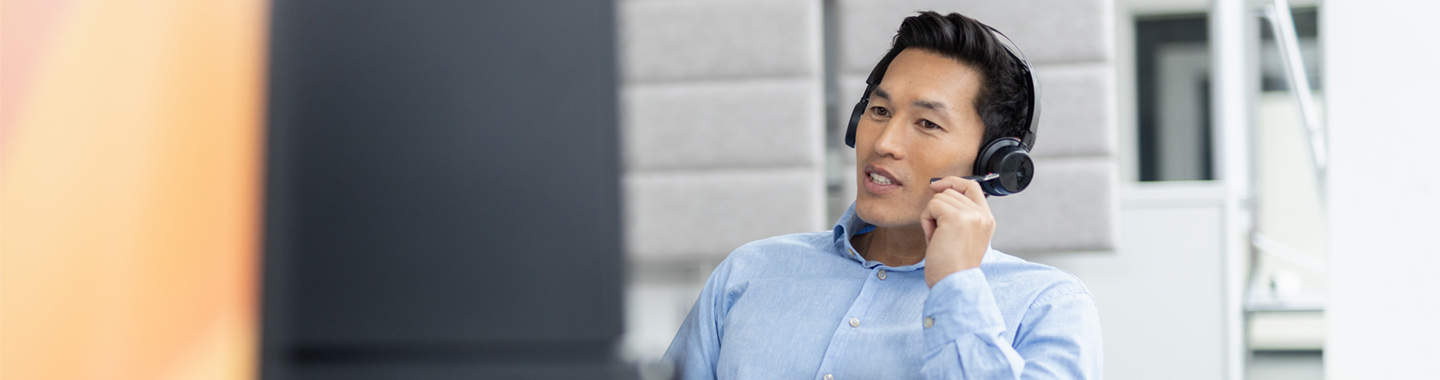A support staff member is on the phone