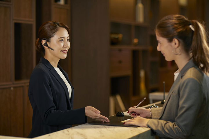 women talking at the hotel reception