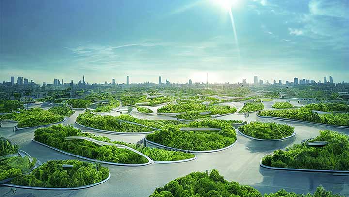 Stadt mit Park und Bäumen im Vordergrund