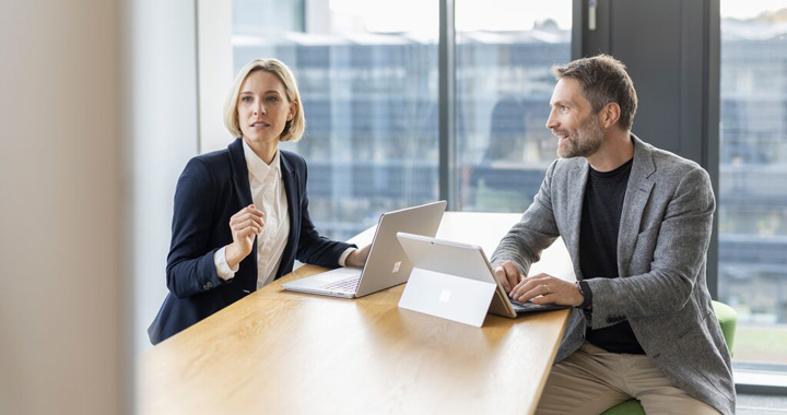 man and woman in the office