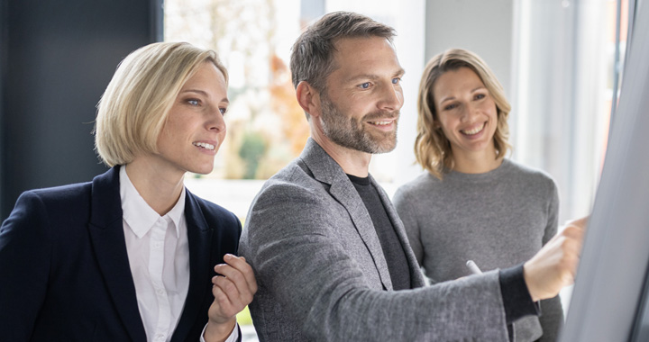 Group of people working at the board