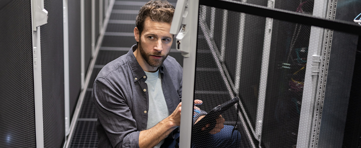 A man is working in the data center