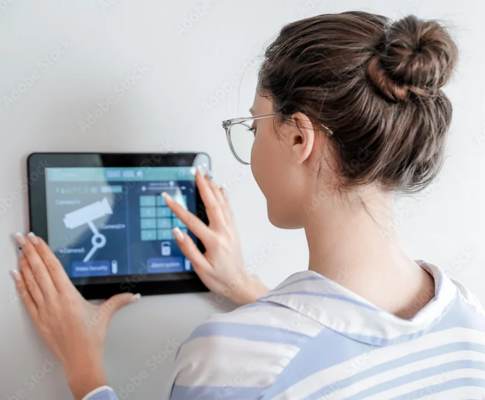 A woman setting up smart home