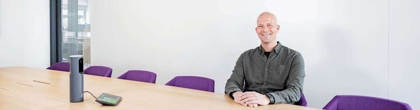 Wim den Hollander sitting in a Bechtle conference room