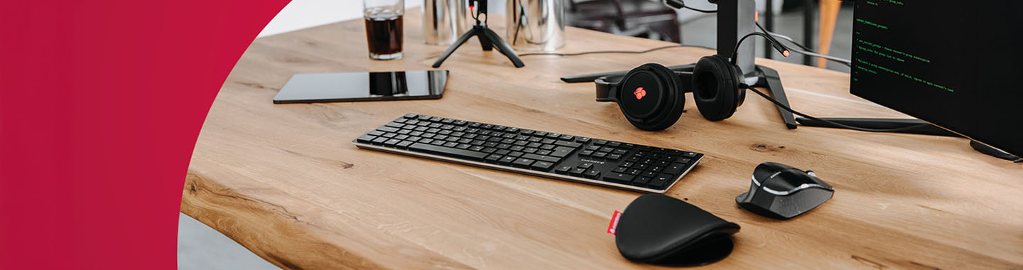 Several CHERRY devices on a wooden table