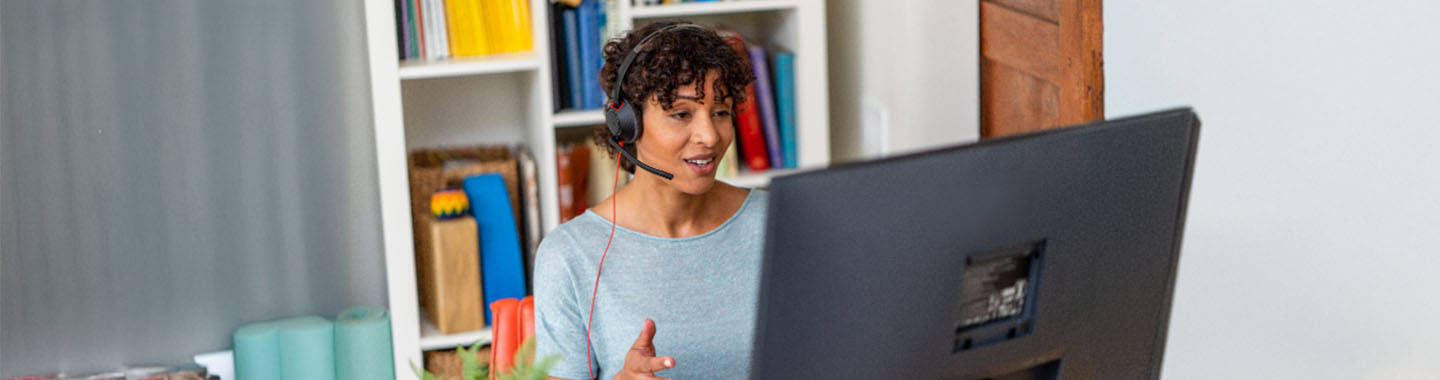 Woman talking with HP Poly Blackwire 3200 Headset